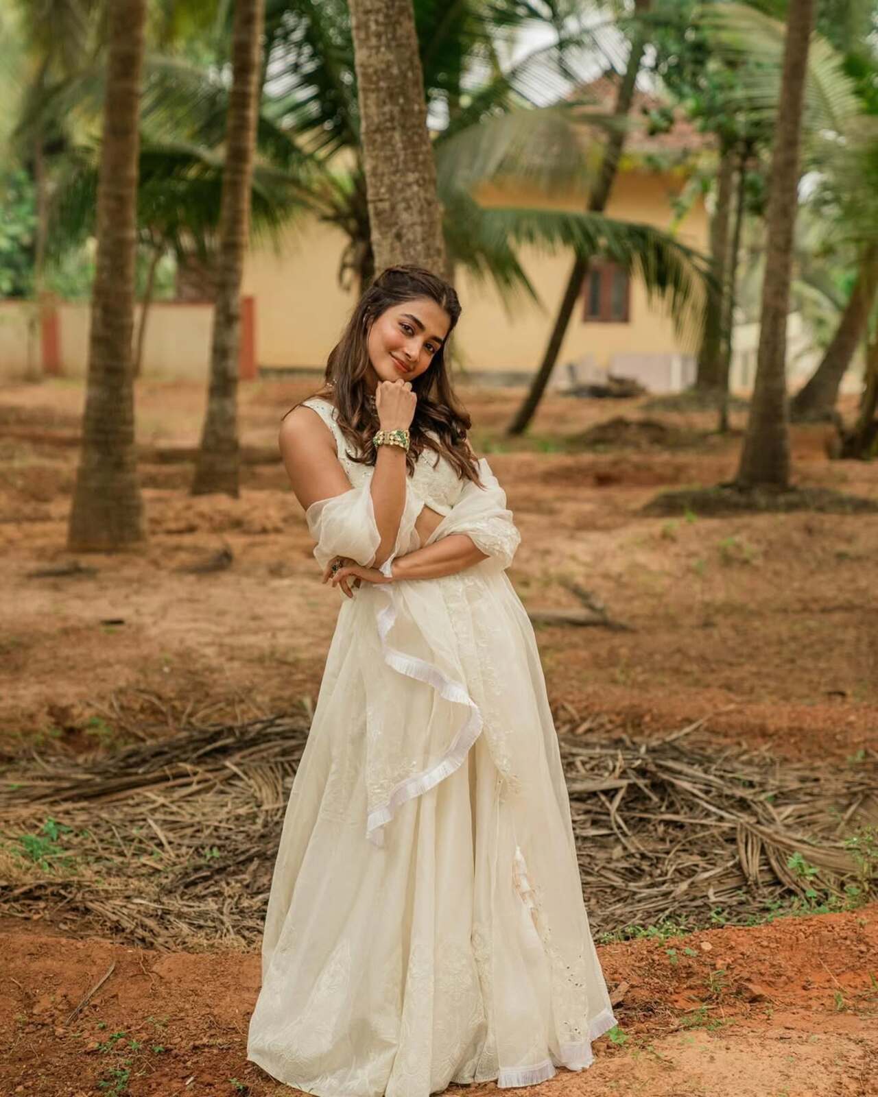 Pooja is glowing in this all-white lehenga. If you are looking for an outfit for your day function, this is the one you should go for